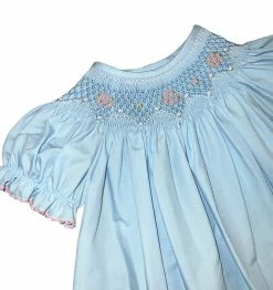 Petit Bebe/Petit Ami/Claire & Charlie Spring/Summer 2023 Lily Bishop Blue Poplin W/Pink Smocking